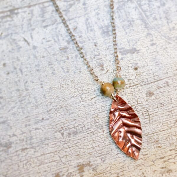 copper leaves pendant with green beads