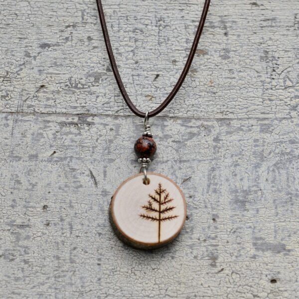 wood burned tree necklace with red stone bead