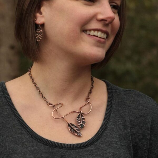 Copper Leaf Collection necklace and earrings on artist Sarah Binder