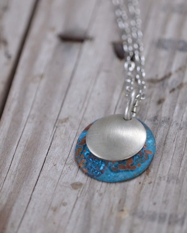 blue patina dome necklace with brushed nickel overlay necklace vertical image on wood