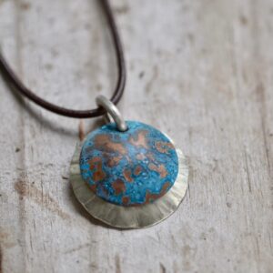 blue patina overlay on textured brushed nickel dome leather necklace detail