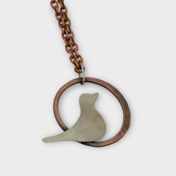 copper and nickel bird silhouette pendant on copper chain