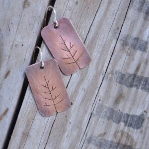 copper tree earrings on wood